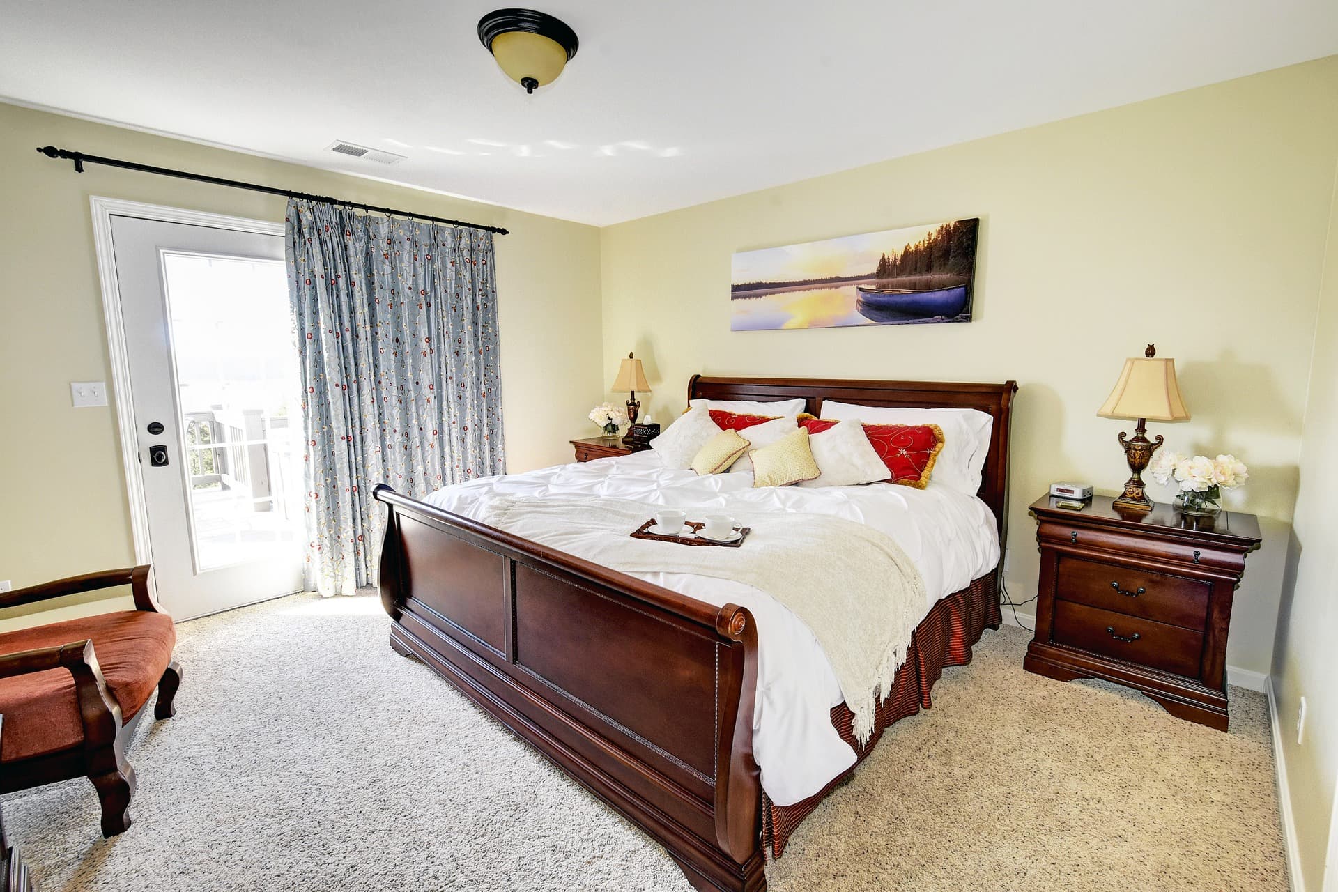 Elegant Lake Cottage in Taylorsville, Kentucky — master bedroom with king-size bed, blackout drapes, and complimentary local bourbon chocolates.