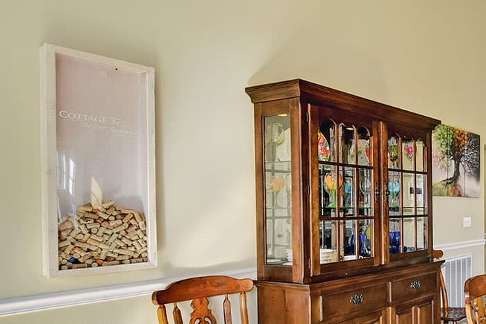 Cork mosaic display with signed wine corks from guests