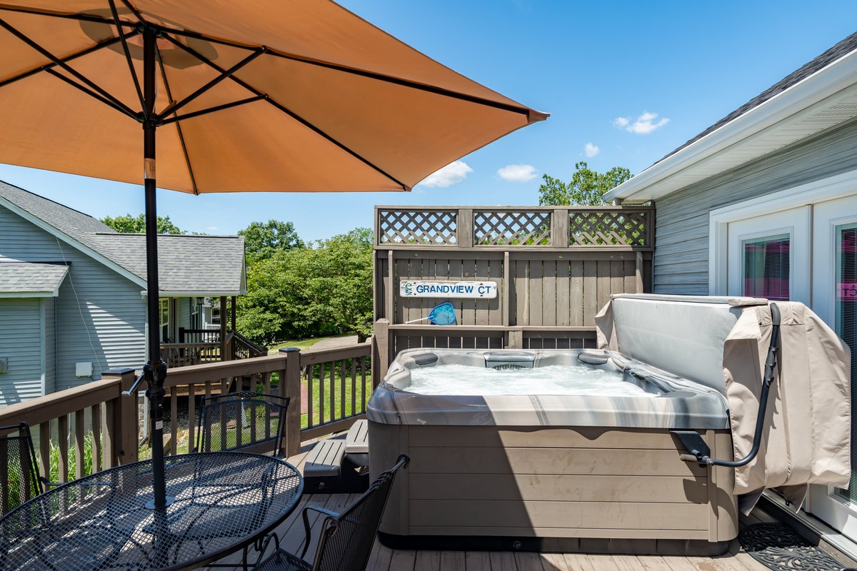 Bullfrog hot tub on the Cottage 37 deck beneath the evening sky