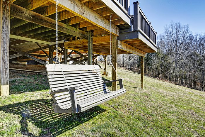 Swing beneath the raised cottage deck