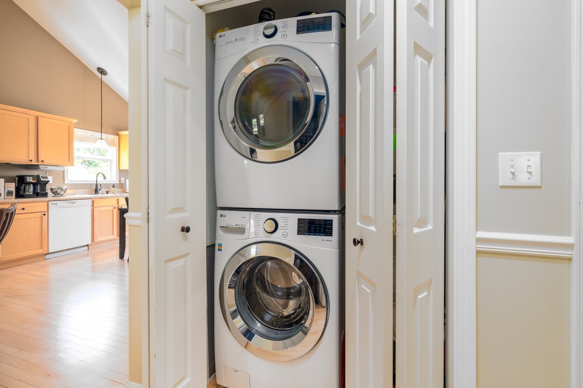 Stacked washer and dryer in the laundry cupboard